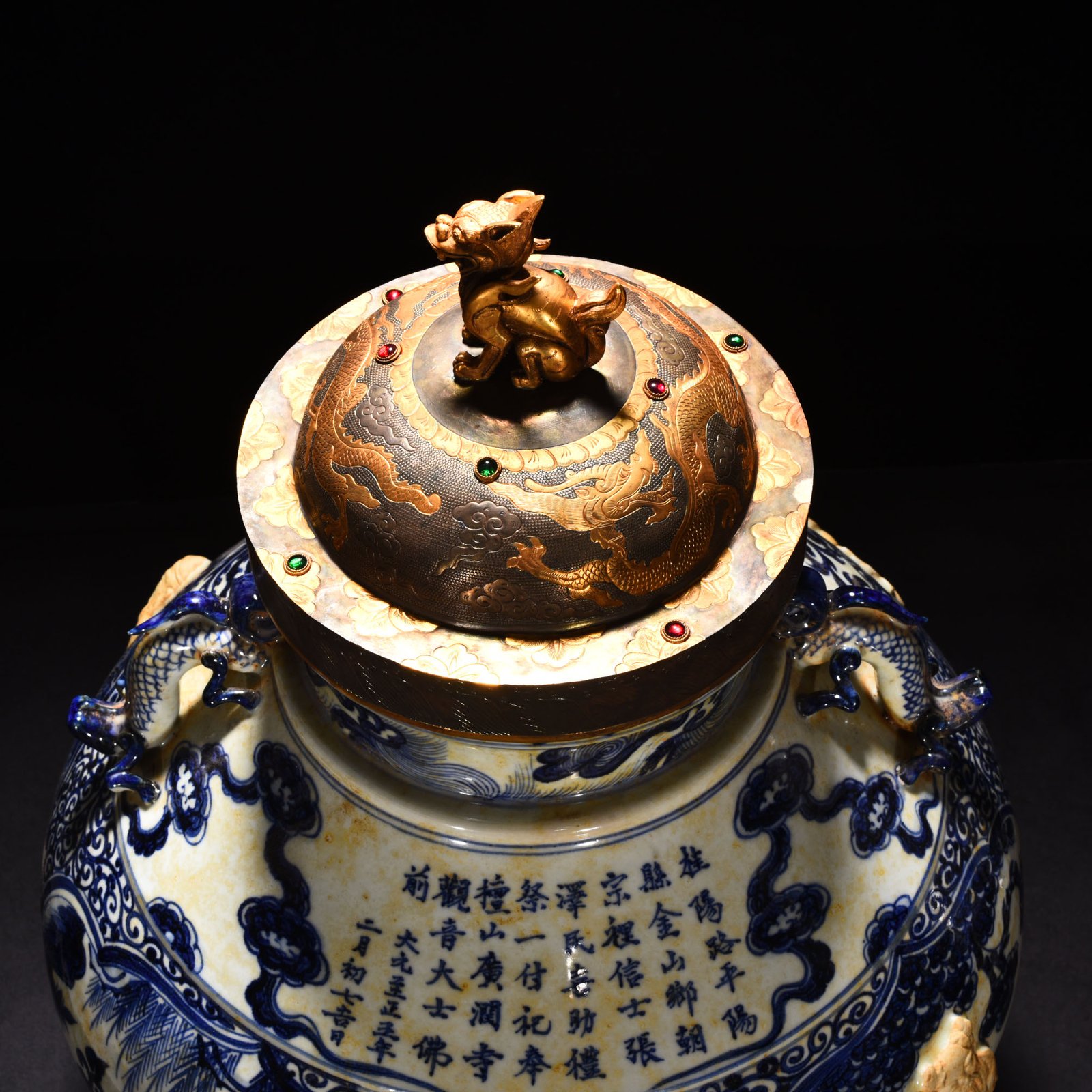 Yuan Dynasty blue and white carved Eight Immortals pattern with ear lid jar