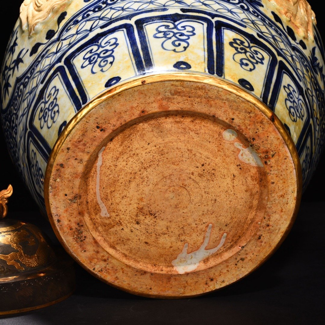 Yuan Dynasty blue and white carved Eight Immortals pattern with ear lid jar