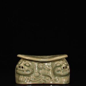 Song Dynasty Yaozhou kiln celadon lion pillow with carved flower pattern