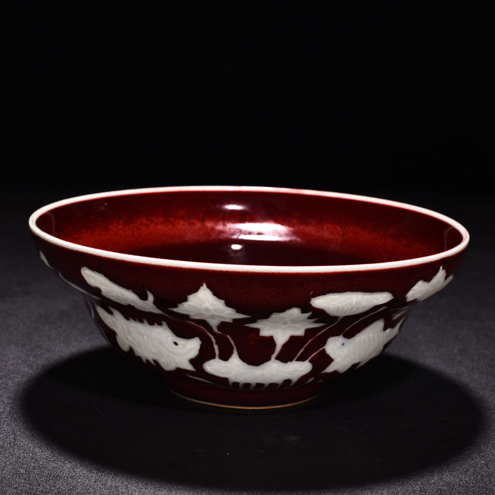 Ming Dyasty Xuande Ji red glaze with white fish and algae pattern folded bowl