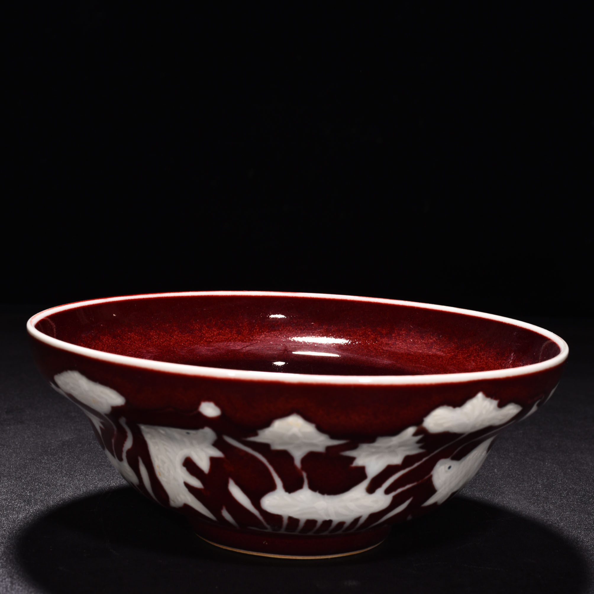 Ming Dyasty Xuande Ji red glaze with white fish and algae pattern folded bowl