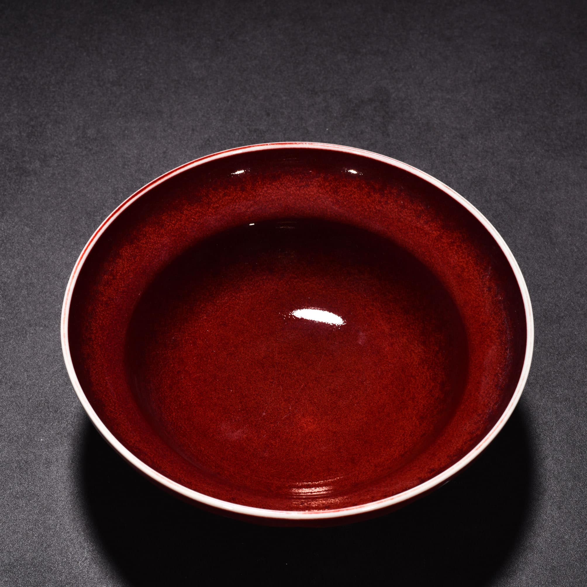 Ming Dyasty Xuande Ji red glaze with white fish and algae pattern folded bowl