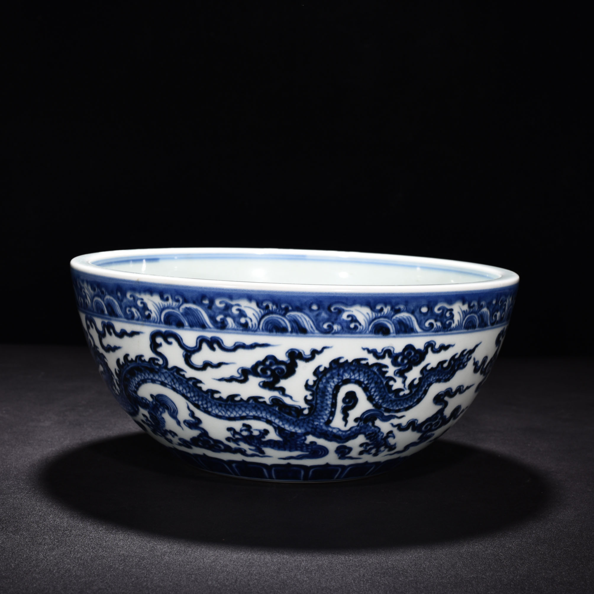 Ming Dynasty Xuande blue and white cloud and dragon pattern bowl