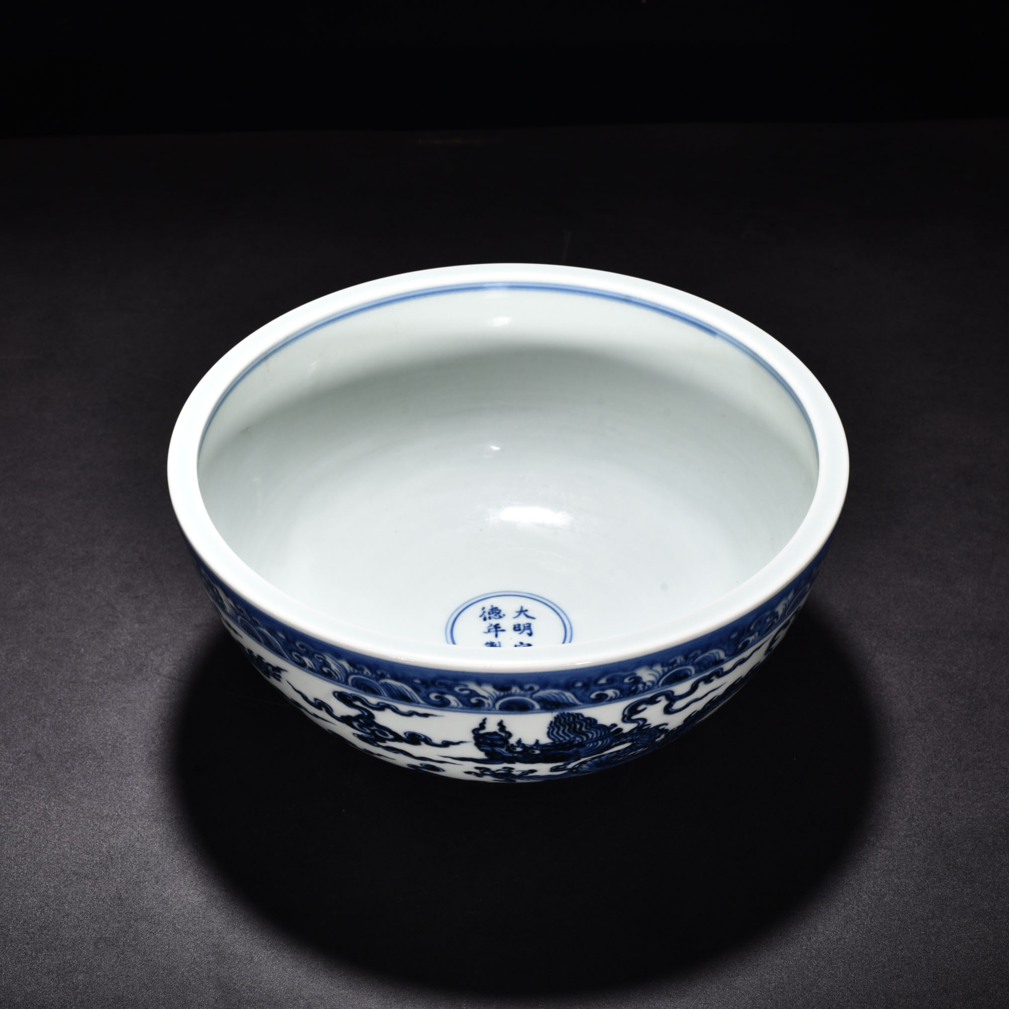 Ming Dynasty Xuande blue and white cloud and dragon pattern bowl