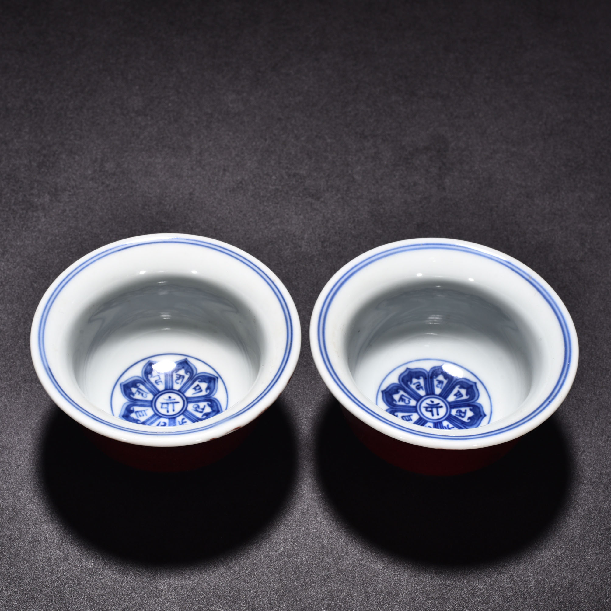 Ming Dynasty Xuande eight treasure Sanskrit red glaze pressed hand cup