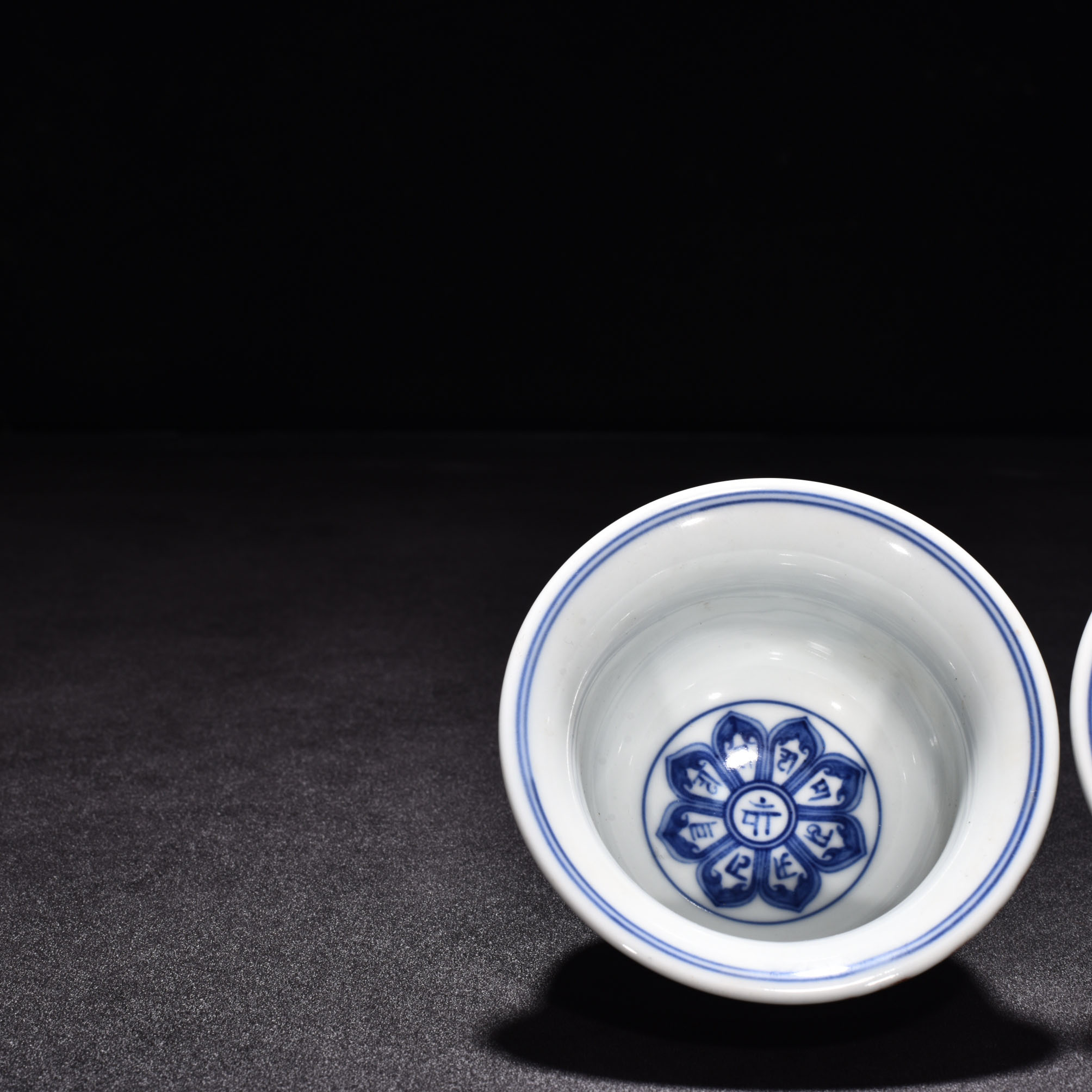Ming Dynasty Xuande eight treasure Sanskrit red glaze pressed hand cup