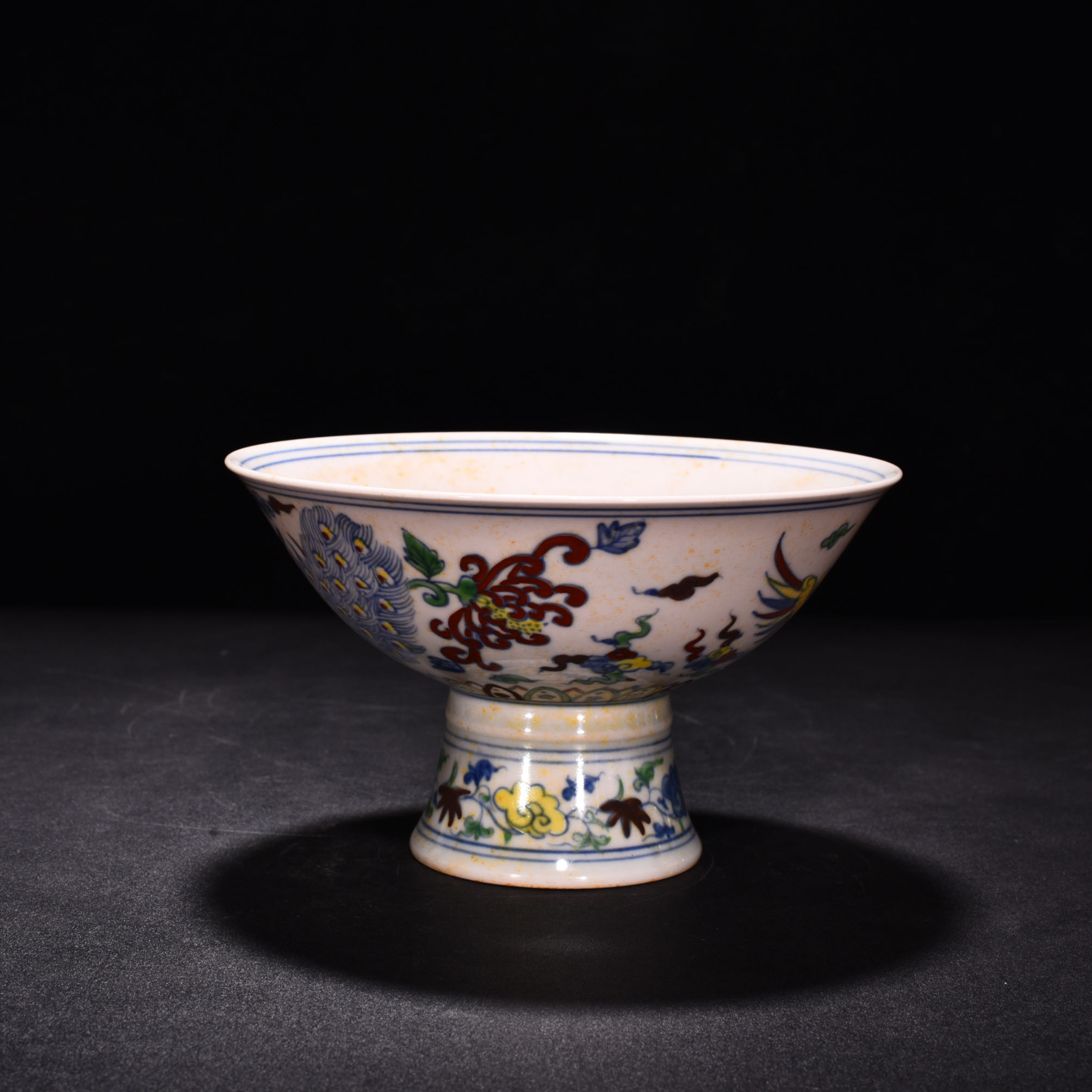 Ming Dynasty Chenghua red body bowl with colorful purple peacock pattern