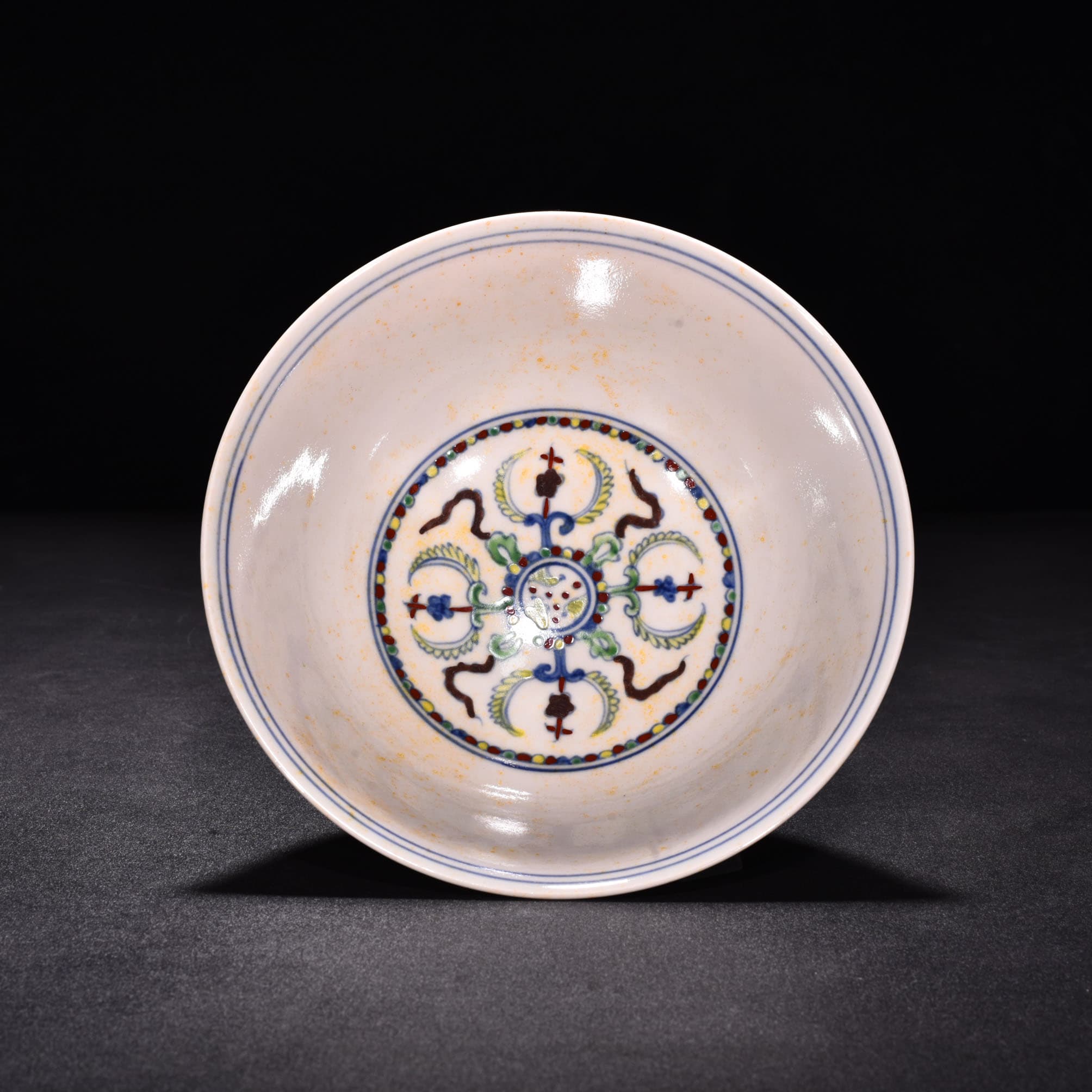 Ming Dynasty Chenghua red body bowl with colorful purple peacock pattern