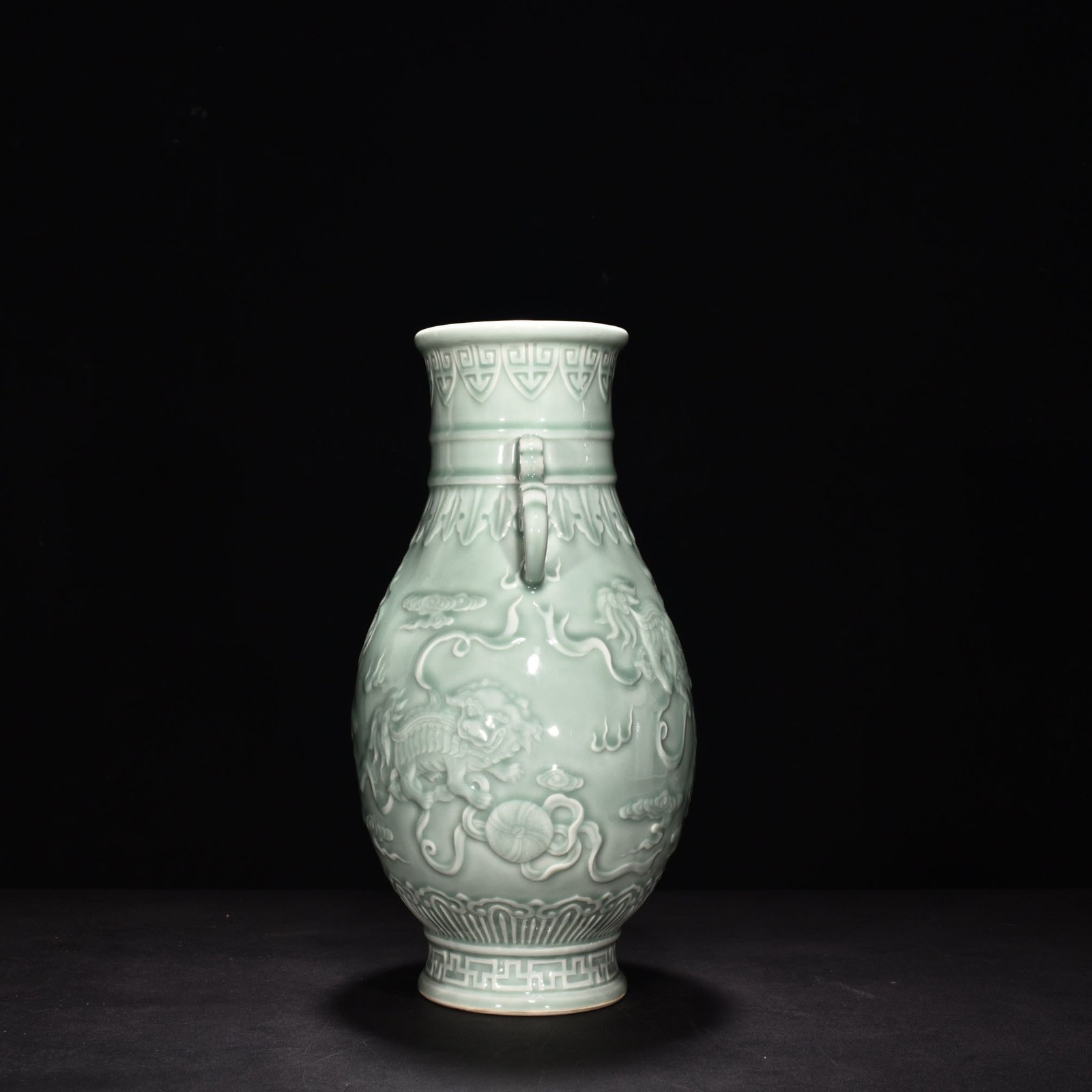 Qing Dynasty Qianlong pink celadon glaze carving vase