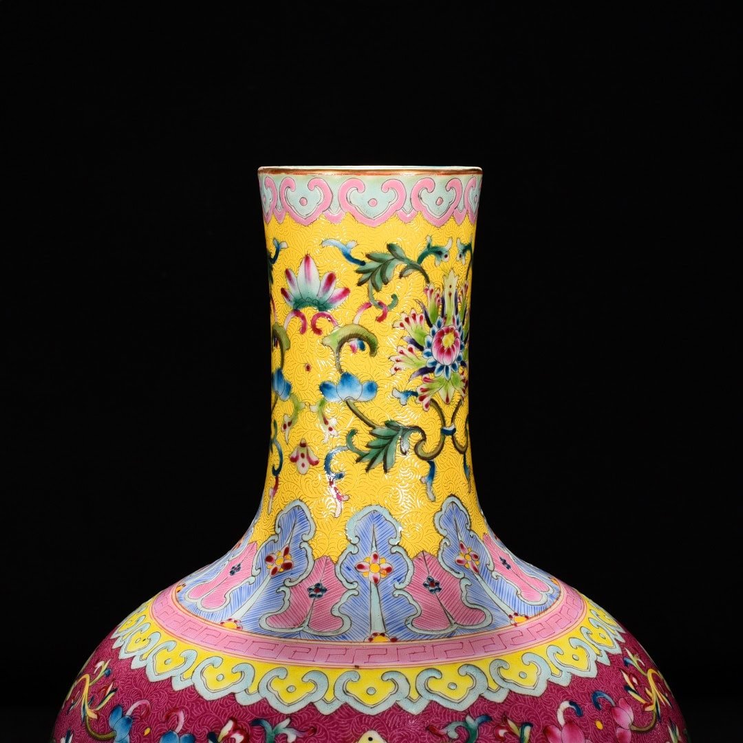 Qing Dynasty Qianlong red ground rolled celestial sphere vase