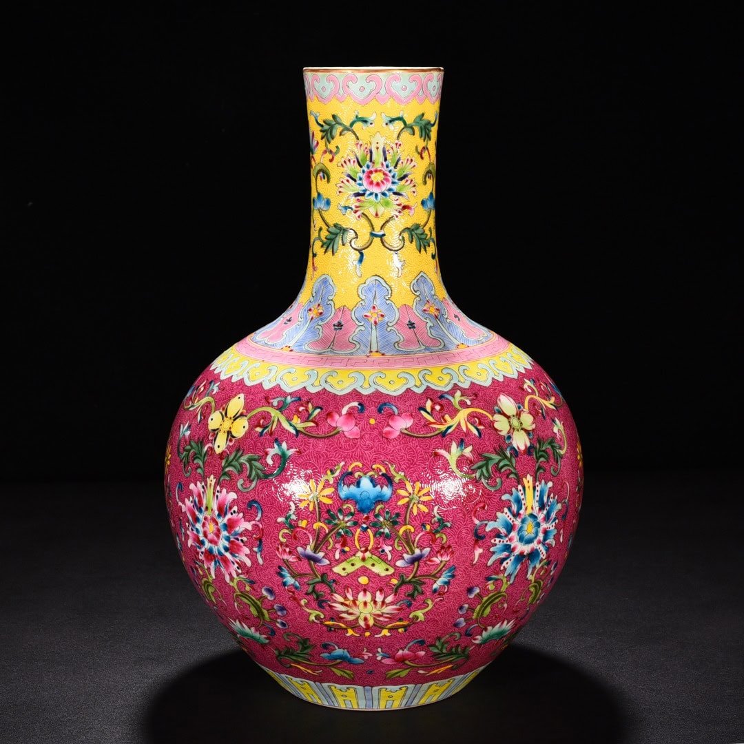 Qing Dynasty Qianlong red ground rolled celestial sphere vase