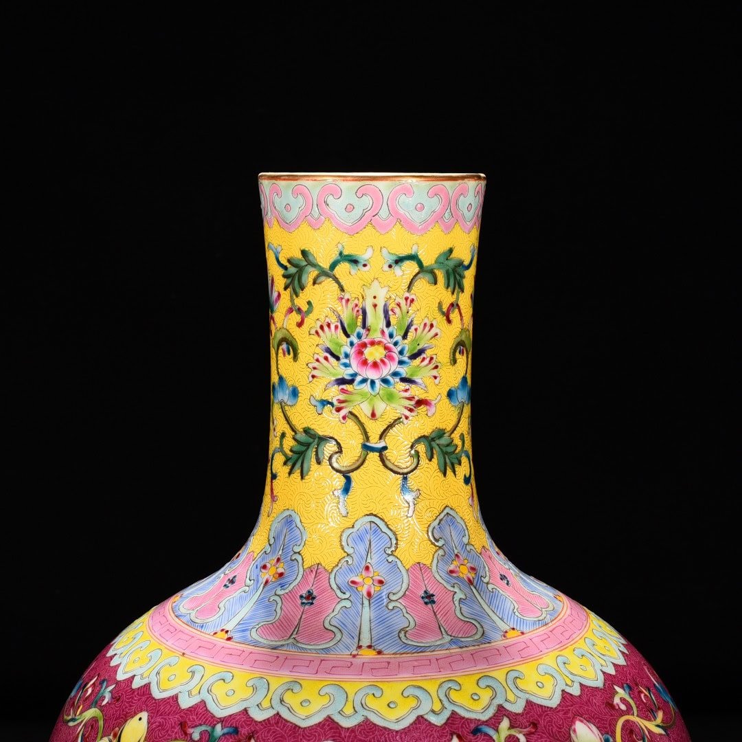 Qing Dynasty Qianlong red ground rolled celestial sphere vase