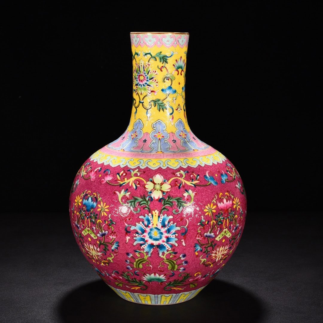 Qing Dynasty Qianlong red ground rolled celestial sphere vase