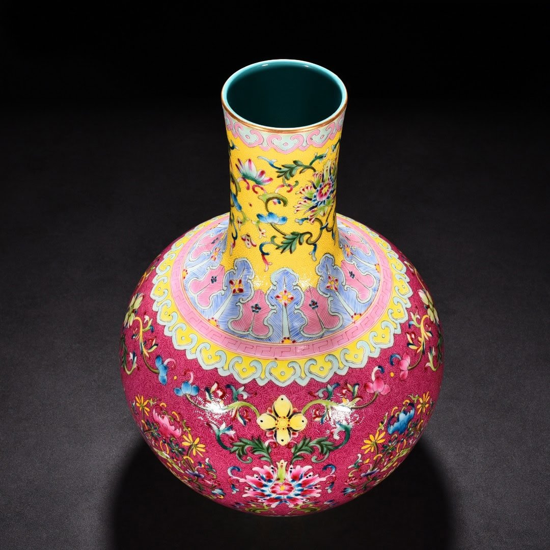 Qing Dynasty Qianlong red ground rolled celestial sphere vase