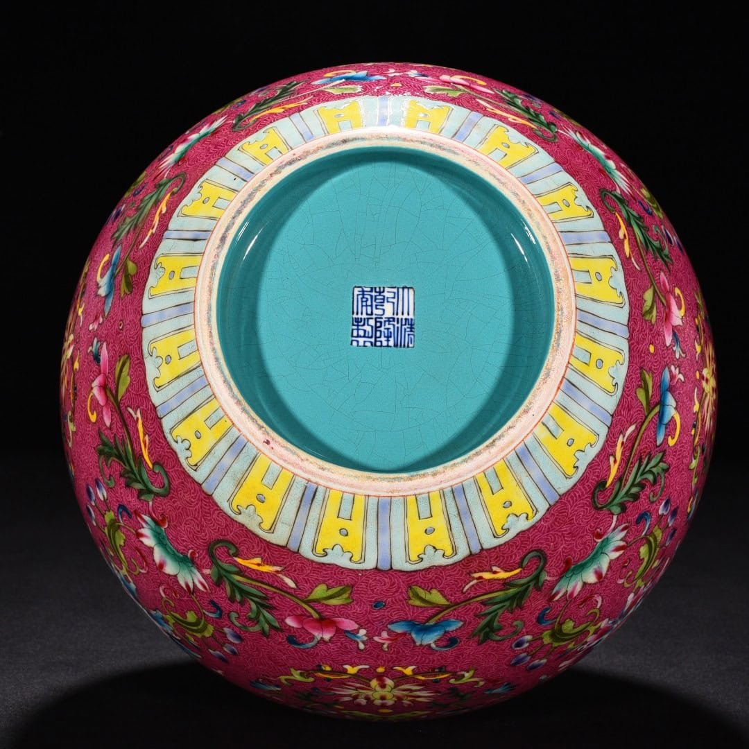 Qing Dynasty Qianlong red ground rolled celestial sphere vase