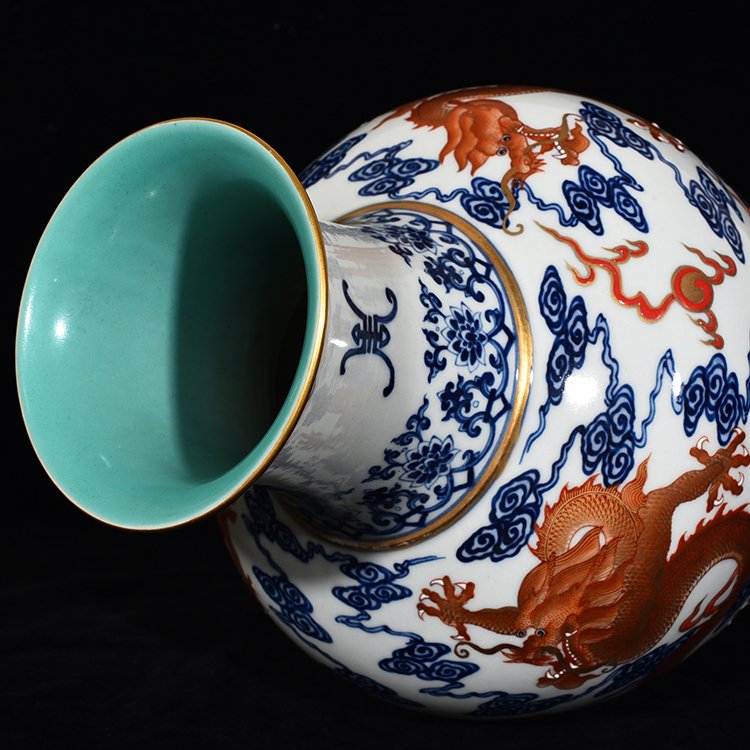 Qing Dynasty Qianlong blue and white alum red Guanyin vase