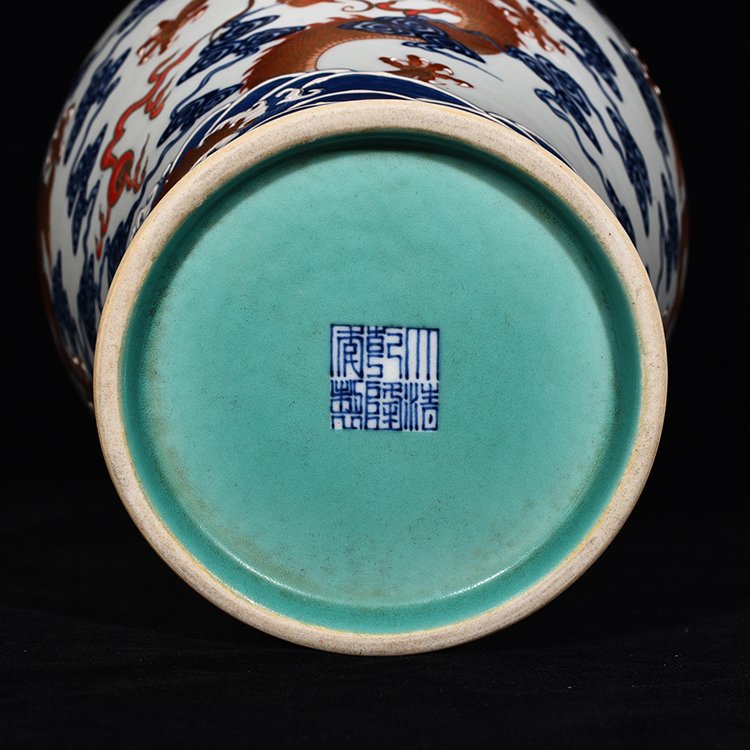 Qing Dynasty Qianlong blue and white alum red Guanyin vase