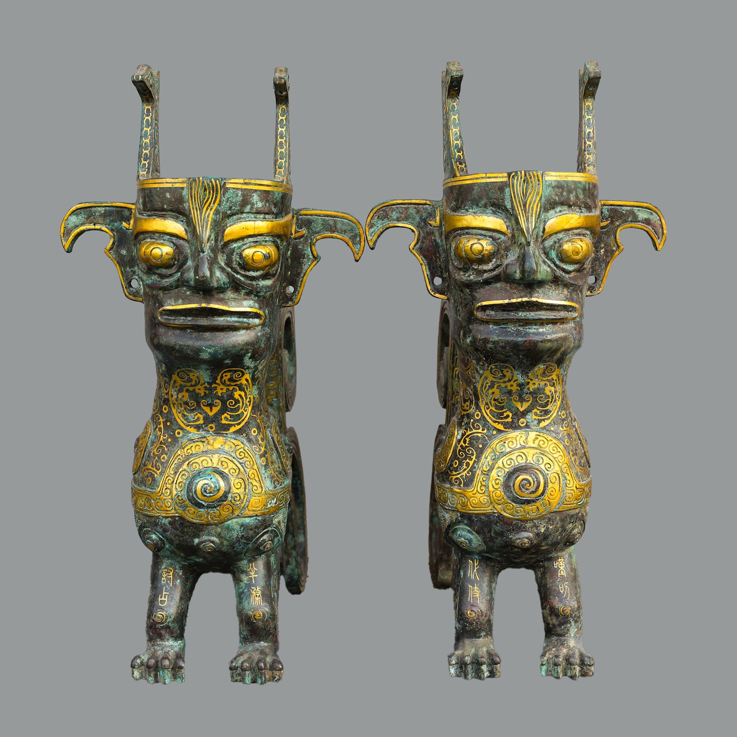 Sanxingdui Dynasty Pair of golden human faced beasts
