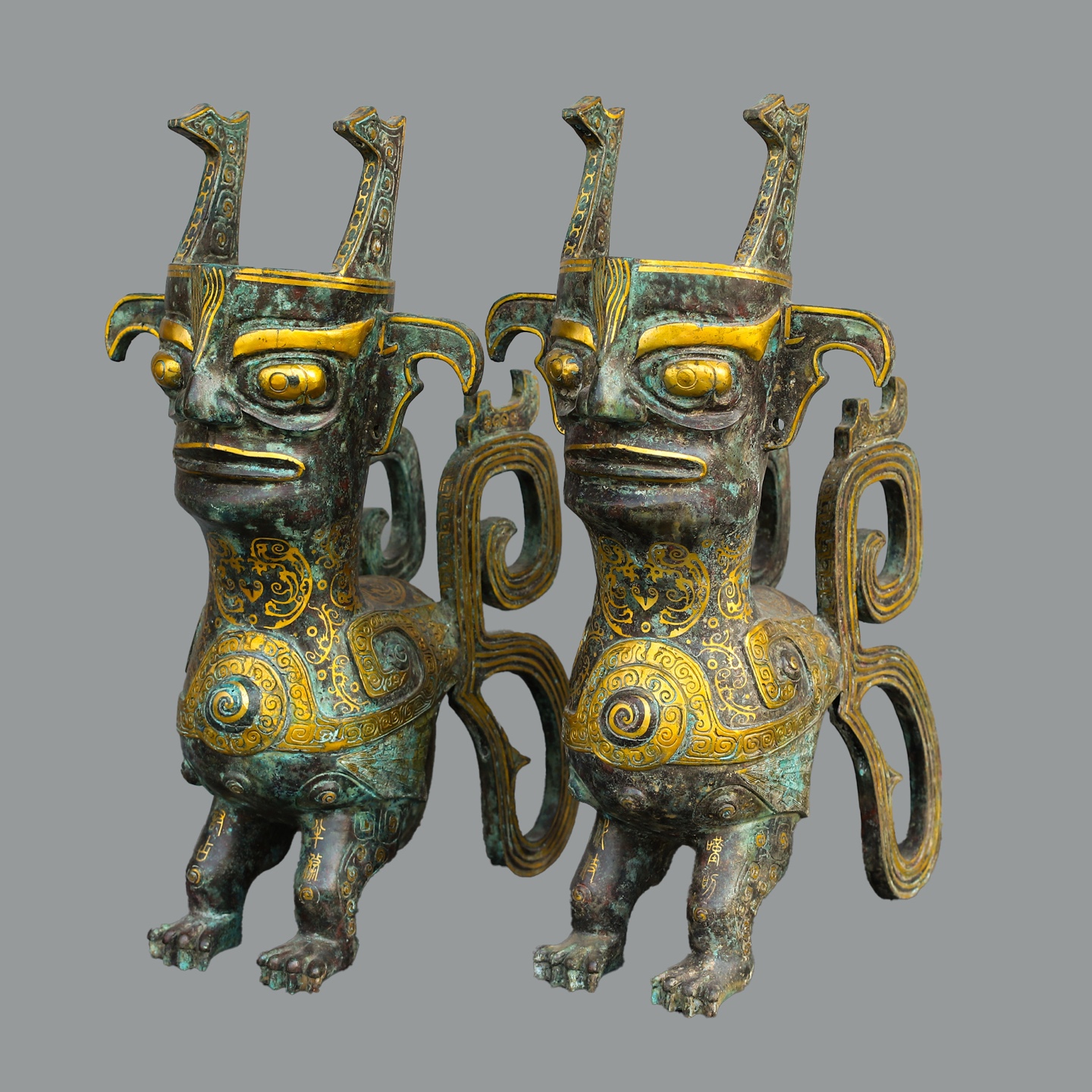 Sanxingdui Dynasty Pair of golden human faced beasts