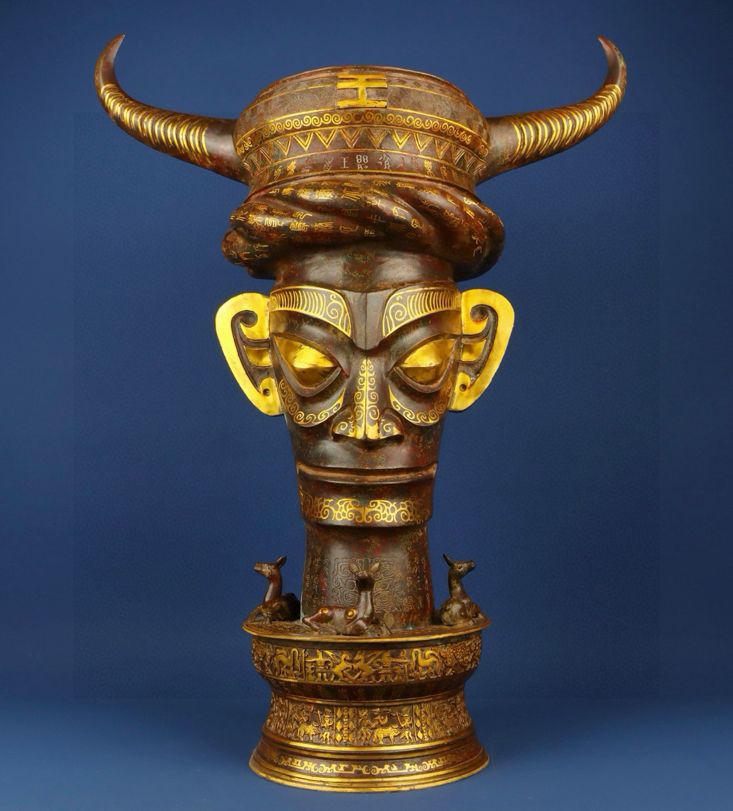 Sanxingdui Dynasty Bronze and gold inlaid human faced bull head drum