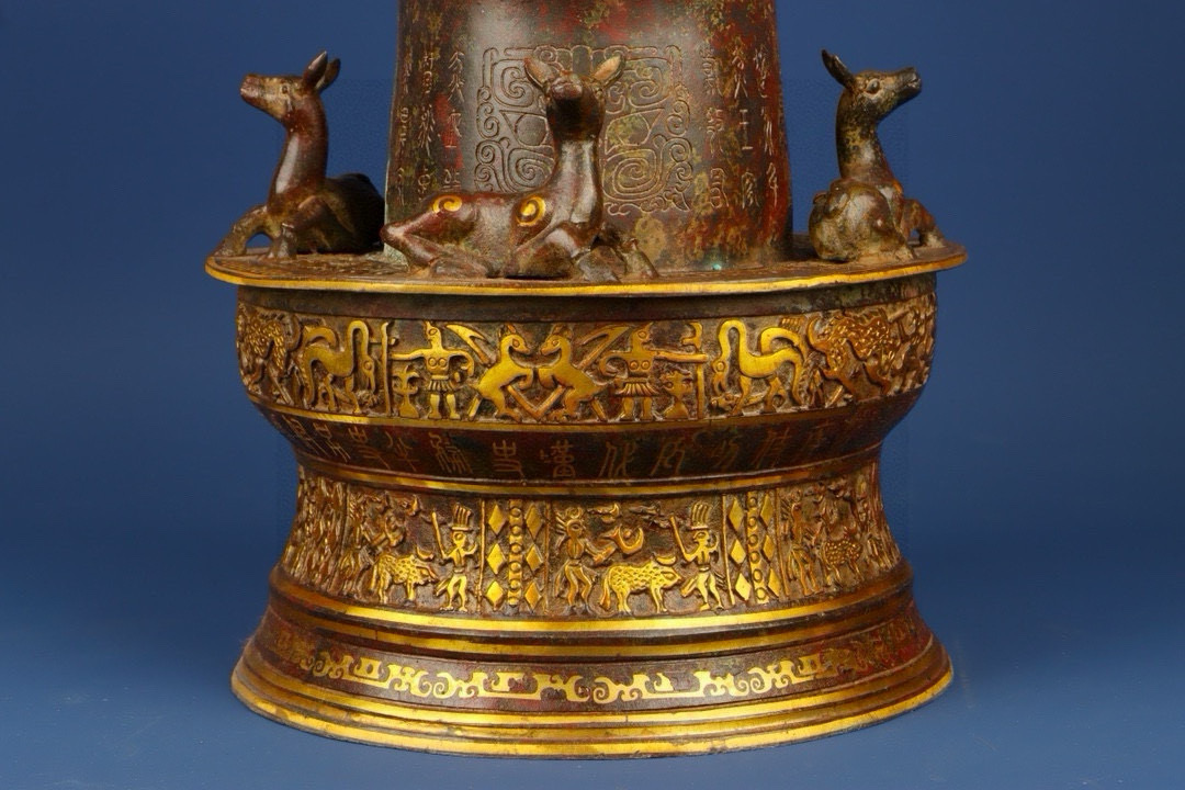 Sanxingdui Dynasty Bronze and gold inlaid human faced bull head drum