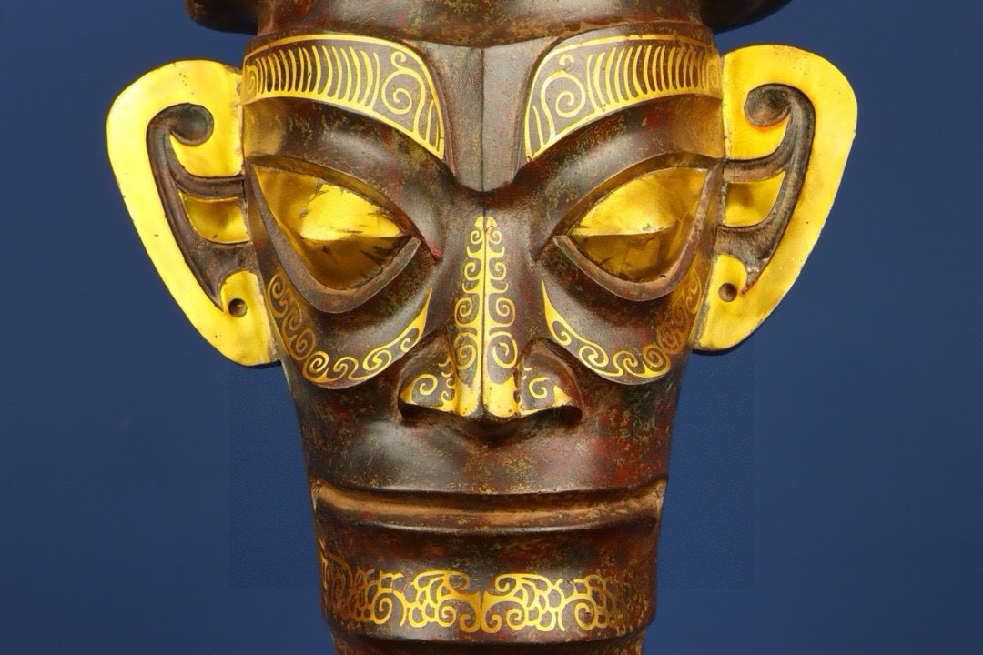 Sanxingdui Dynasty Bronze and gold inlaid human faced bull head drum
