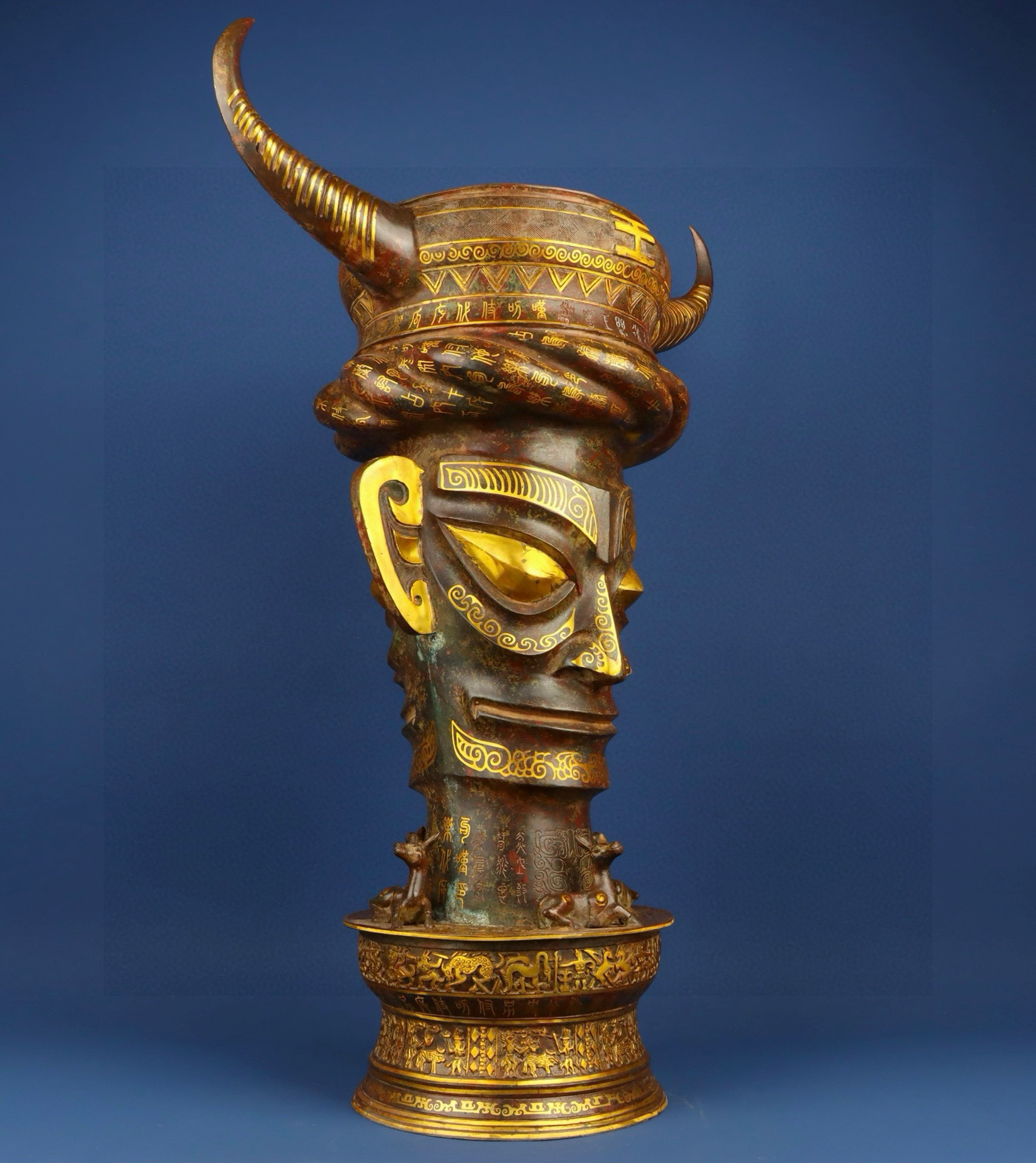 Sanxingdui Dynasty Bronze and gold inlaid human faced bull head drum