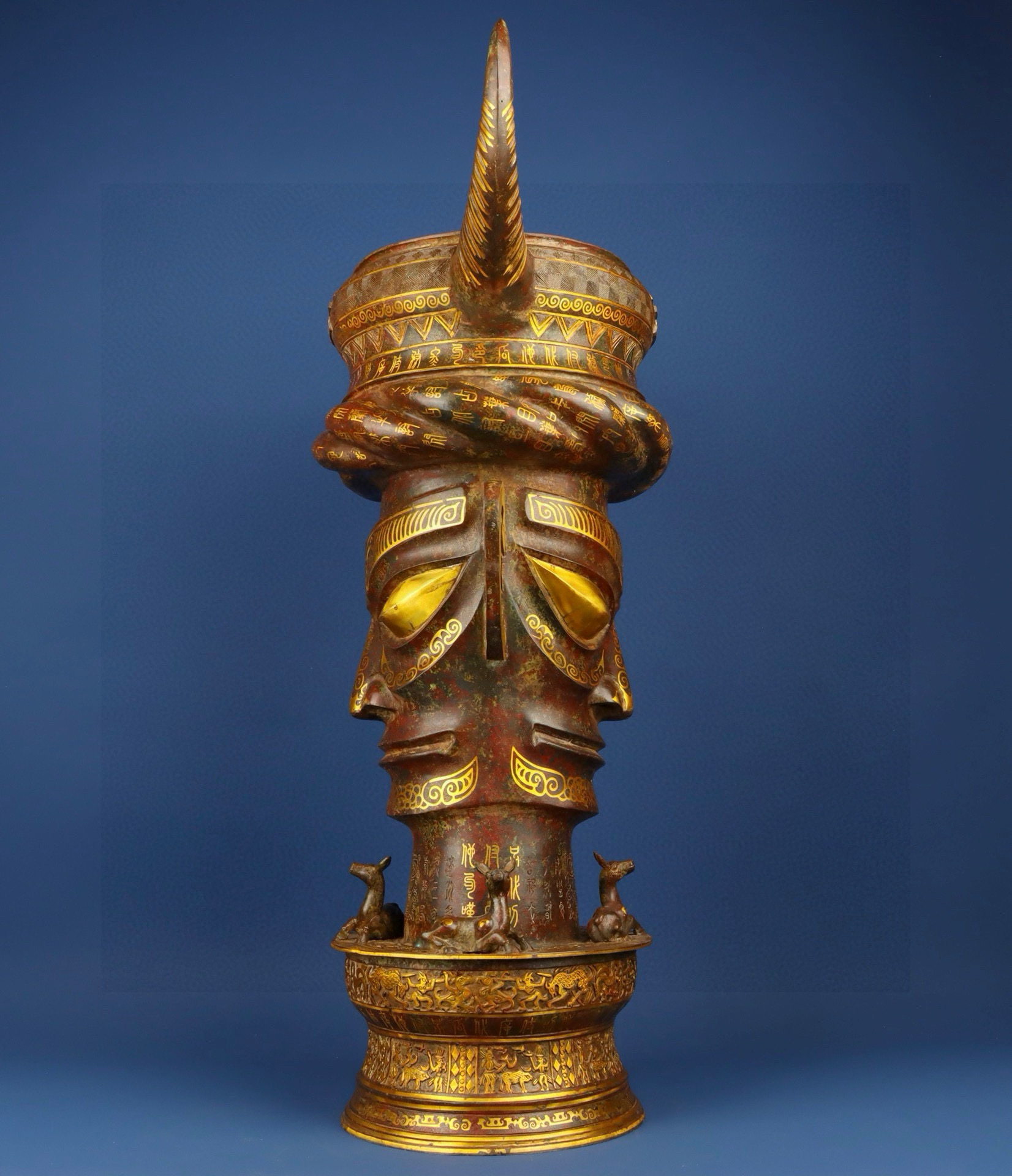 Sanxingdui Dynasty Bronze and gold inlaid human faced bull head drum