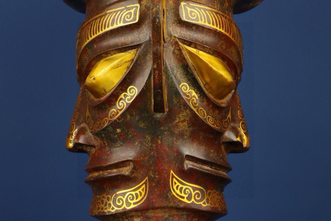 Sanxingdui Dynasty Bronze and gold inlaid human faced bull head drum