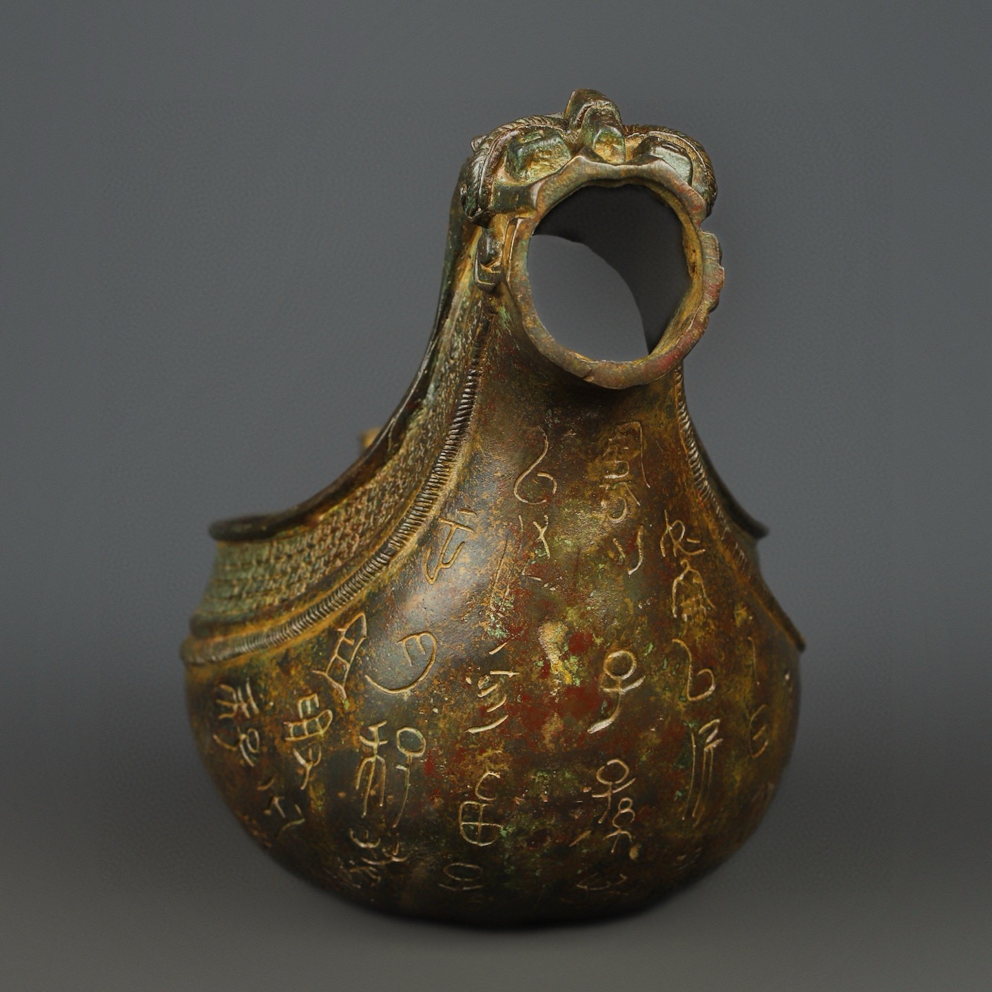 Zhou Dynasty Bronze animal head inscription