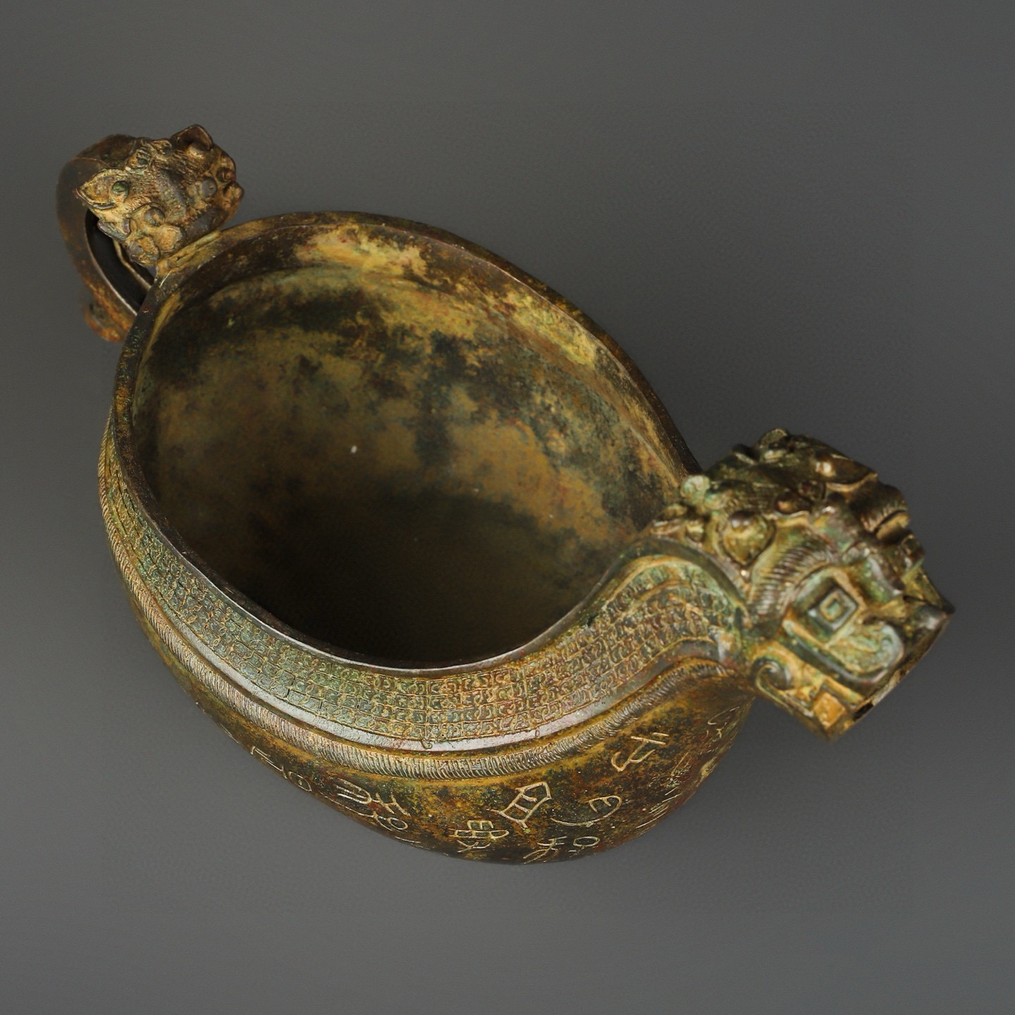Zhou Dynasty Bronze animal head inscription