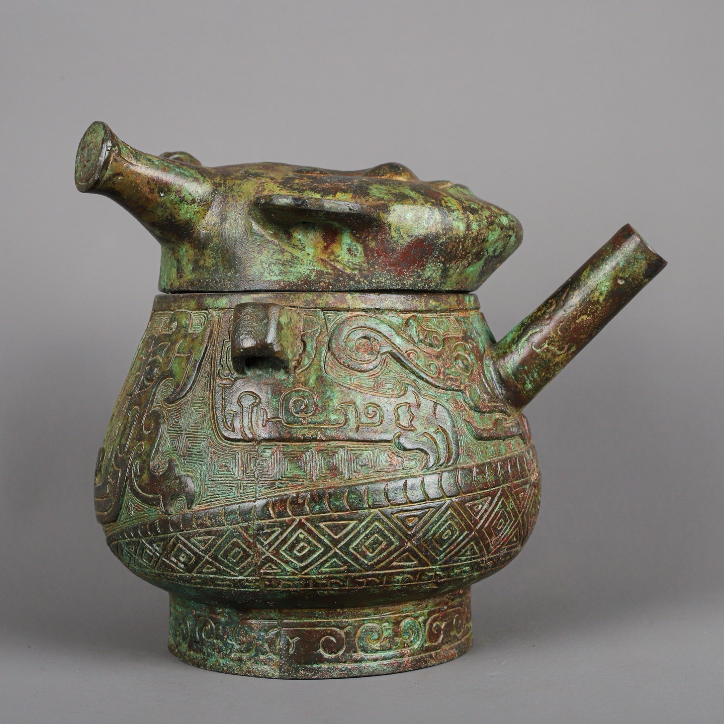 Zhou Dynasty Bronze Human Face Pot