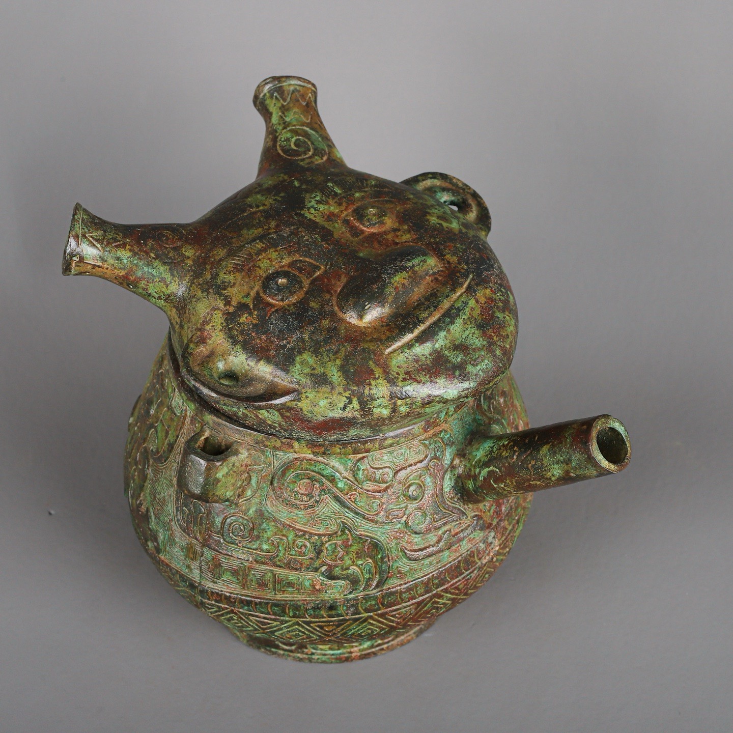 Zhou Dynasty Bronze Human Face Pot