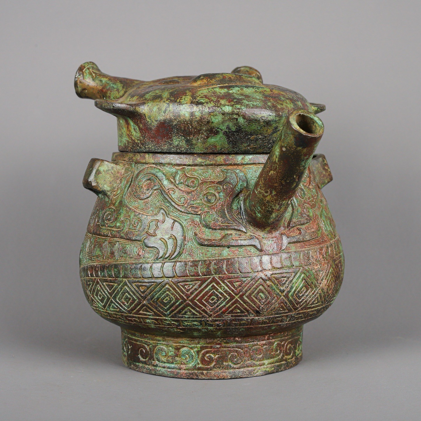Zhou Dynasty Bronze Human Face Pot
