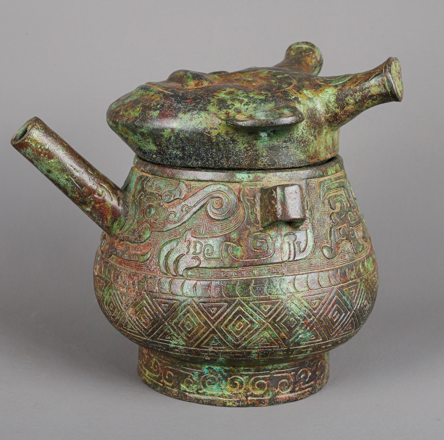 Zhou Dynasty Bronze Human Face Pot