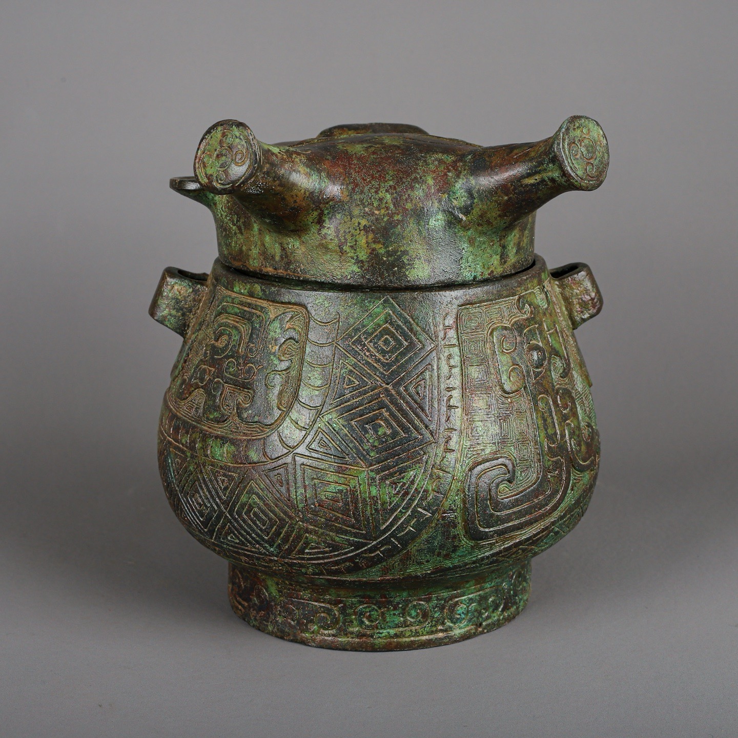 Zhou Dynasty Bronze Human Face Pot