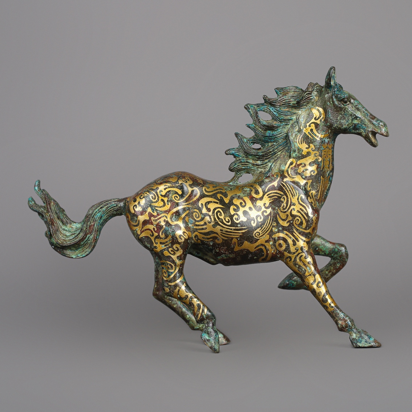 Han Dynasty Bronze and Gold Galloping Horse