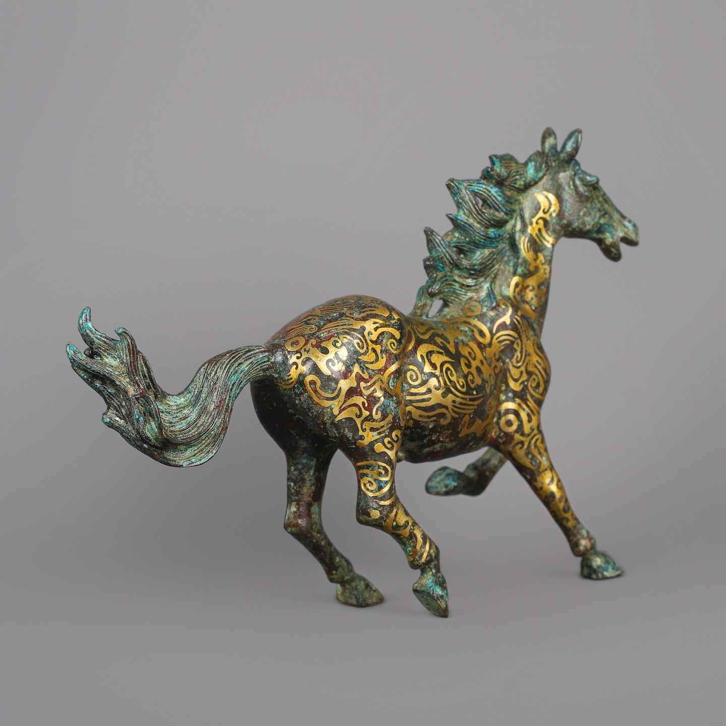 Han Dynasty Bronze and Gold Galloping Horse