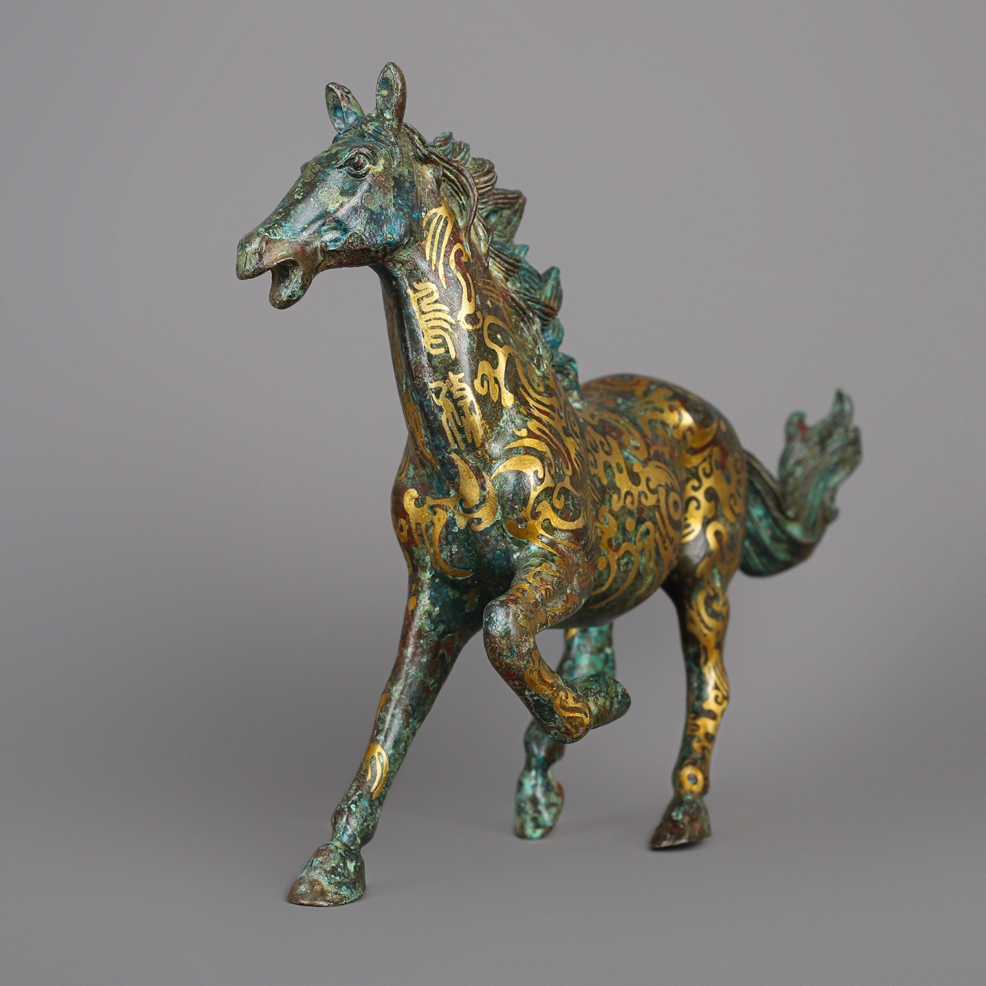 Han Dynasty Bronze and Gold Galloping Horse