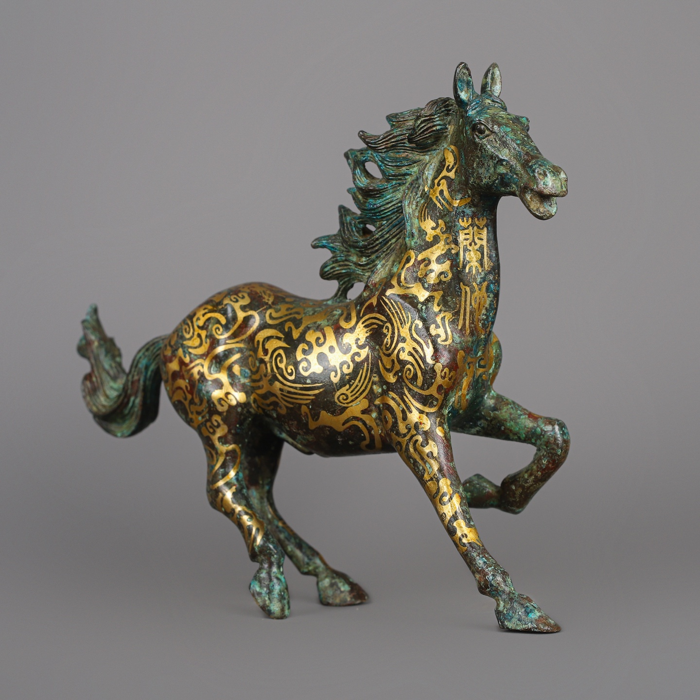 Han Dynasty Bronze and Gold Galloping Horse