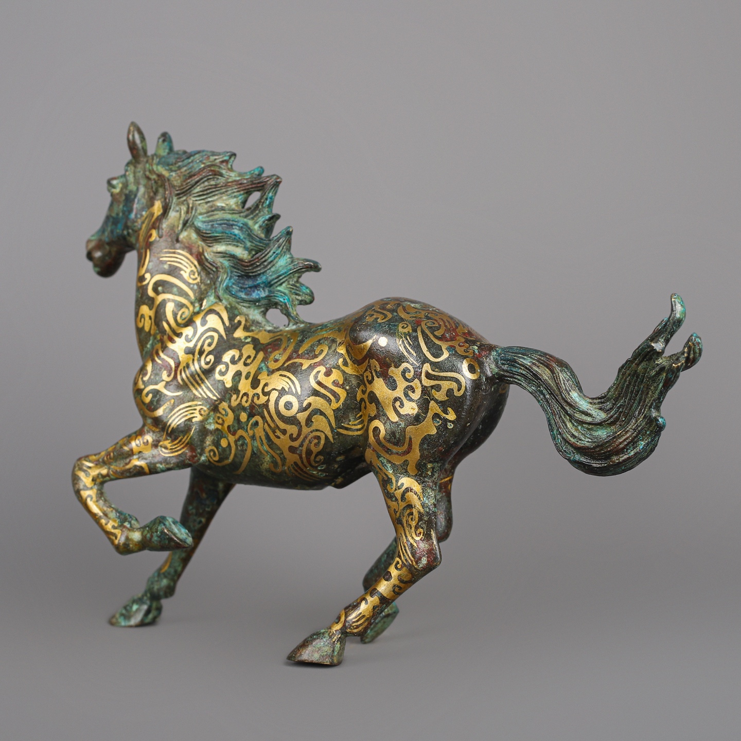 Han Dynasty Bronze and Gold Galloping Horse