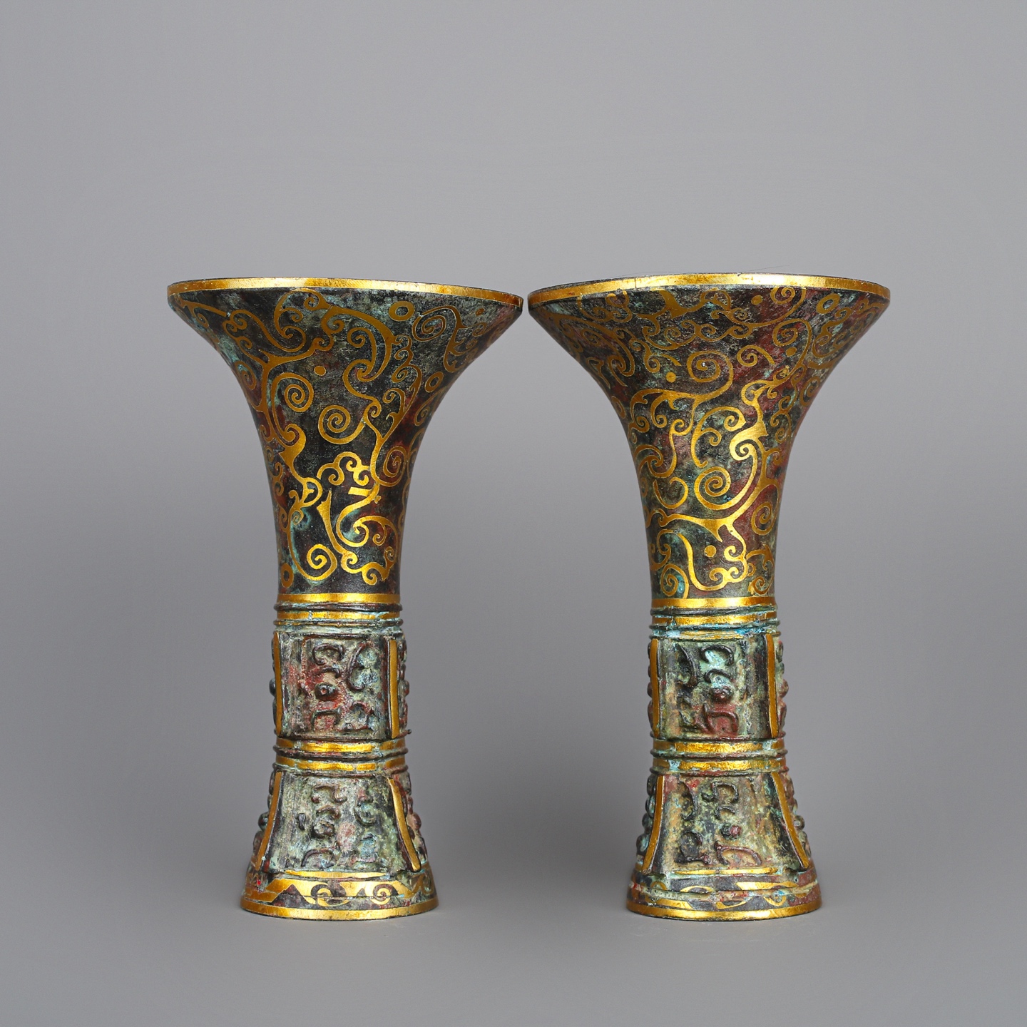 Han Dynasty A pair of bronze and gold flower goblets