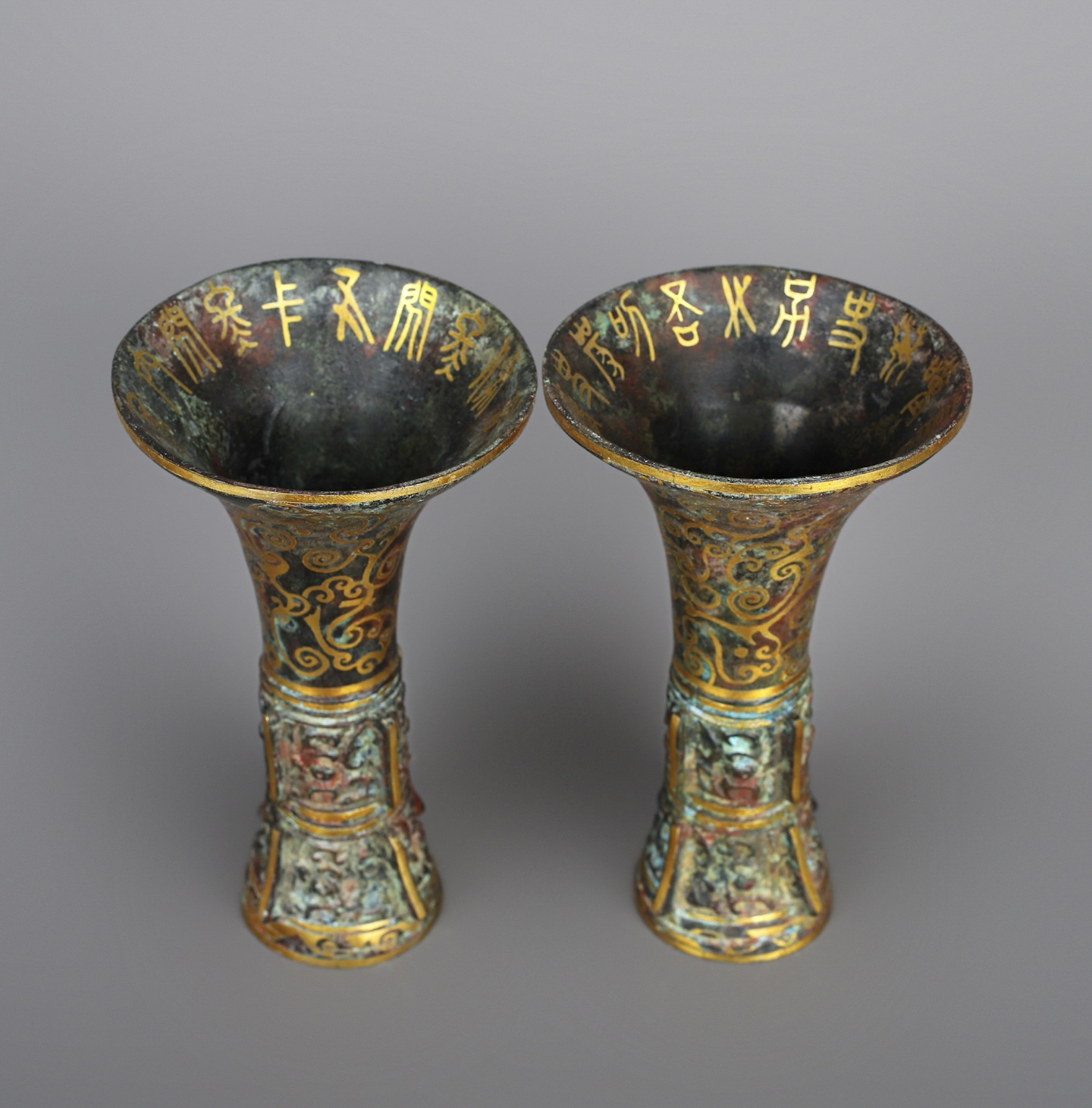Han Dynasty A pair of bronze and gold flower goblets
