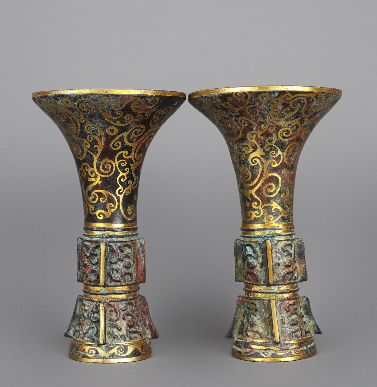 Han Dynasty A pair of bronze and gold flower goblets