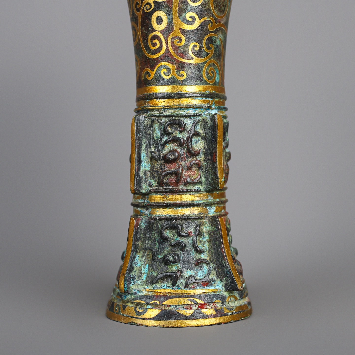 Han Dynasty A pair of bronze and gold flower goblets
