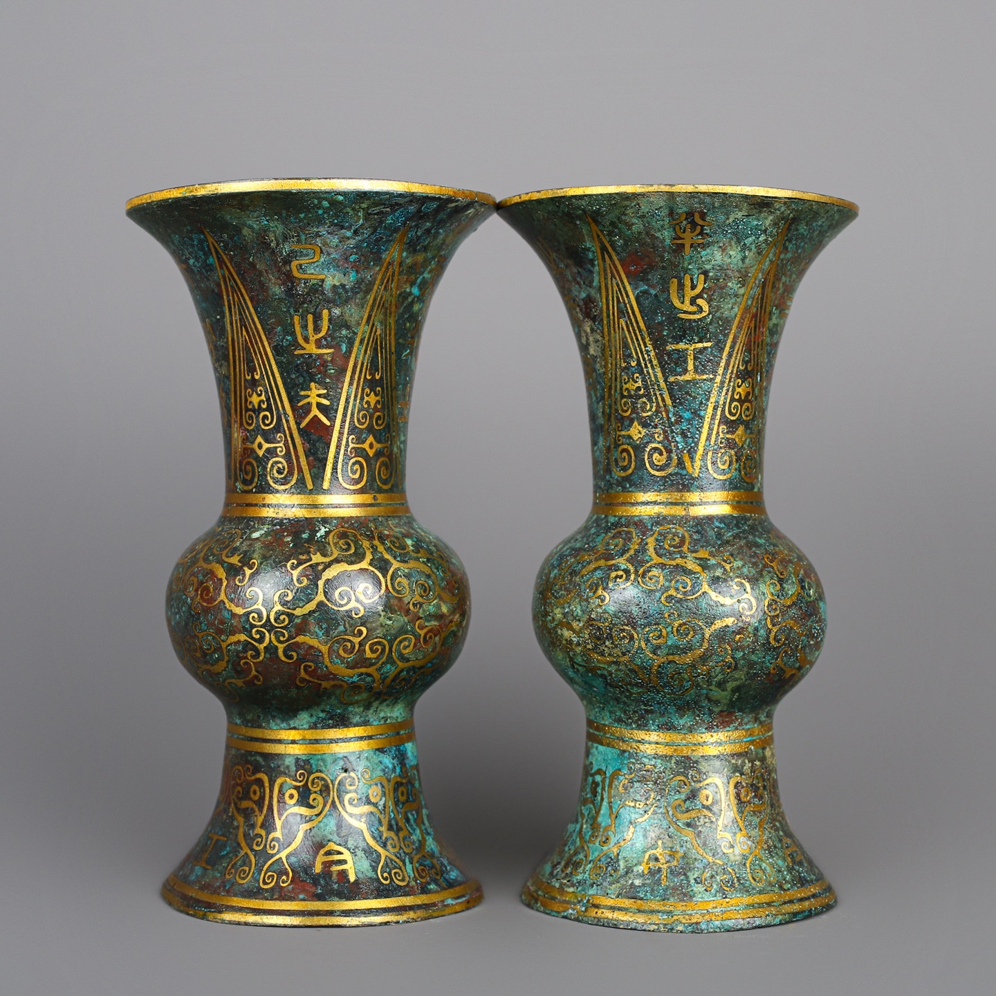 Han Dynasty A pair of bronze and gold round statues