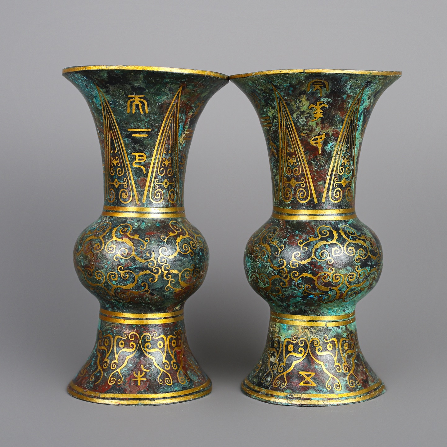 Han Dynasty A pair of bronze and gold round statues