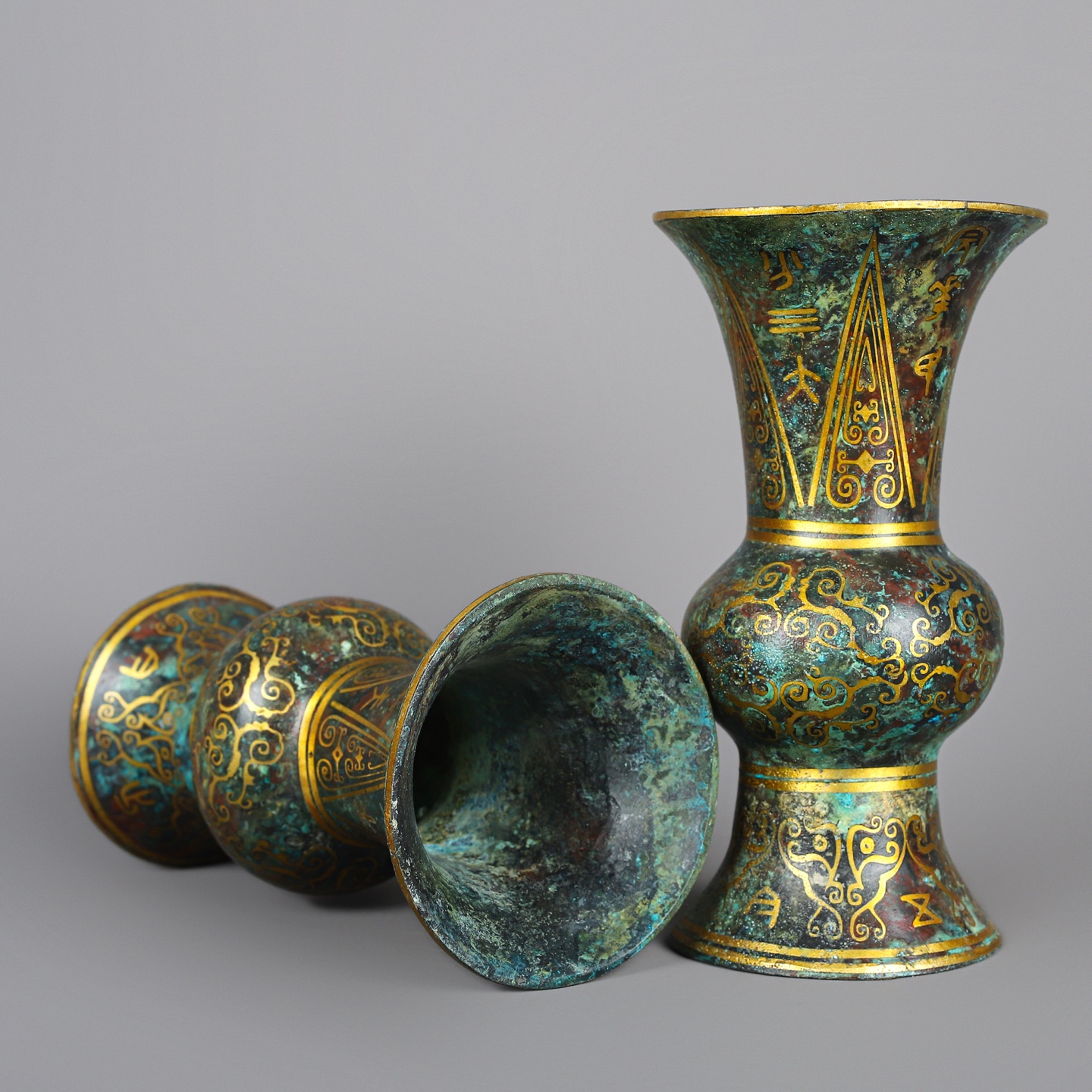 Han Dynasty A pair of bronze and gold round statues