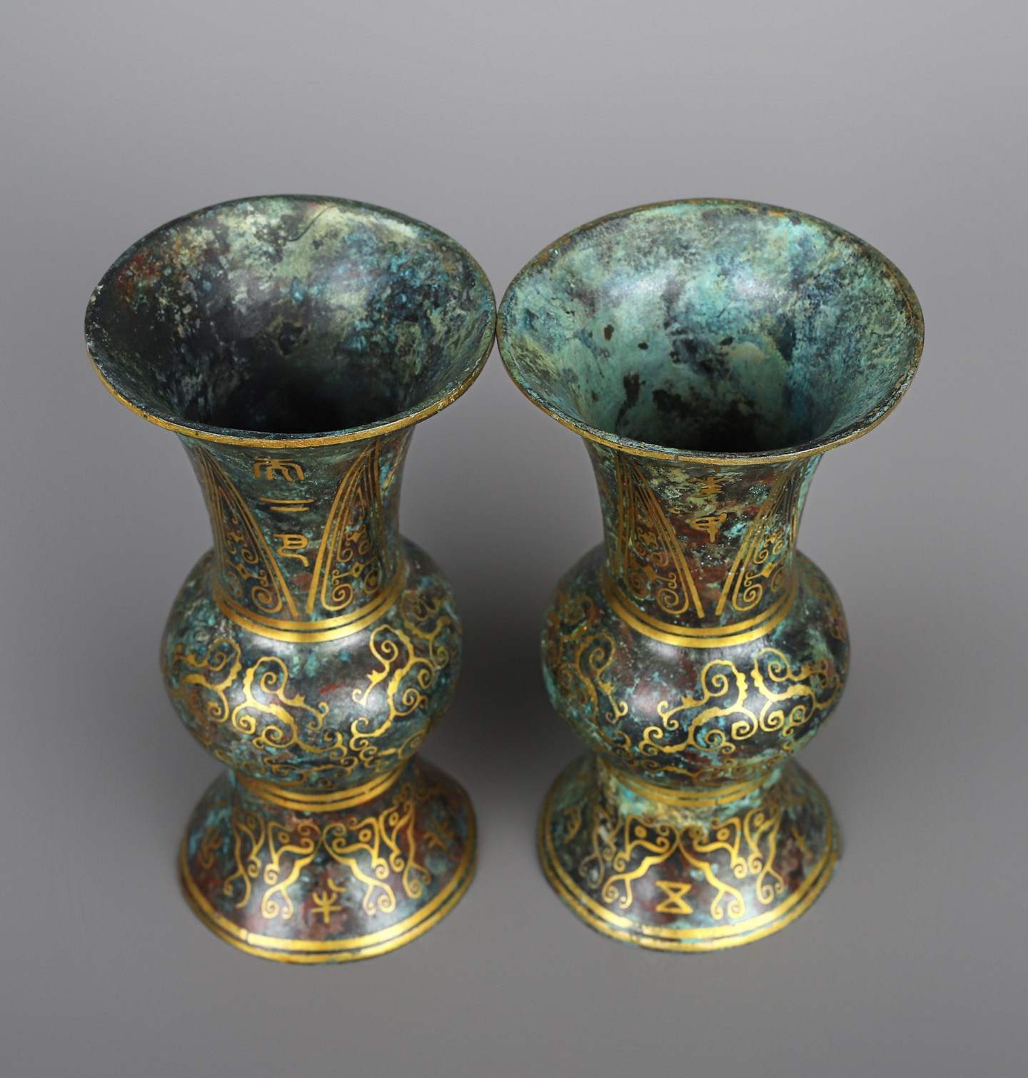 Han Dynasty A pair of bronze and gold round statues