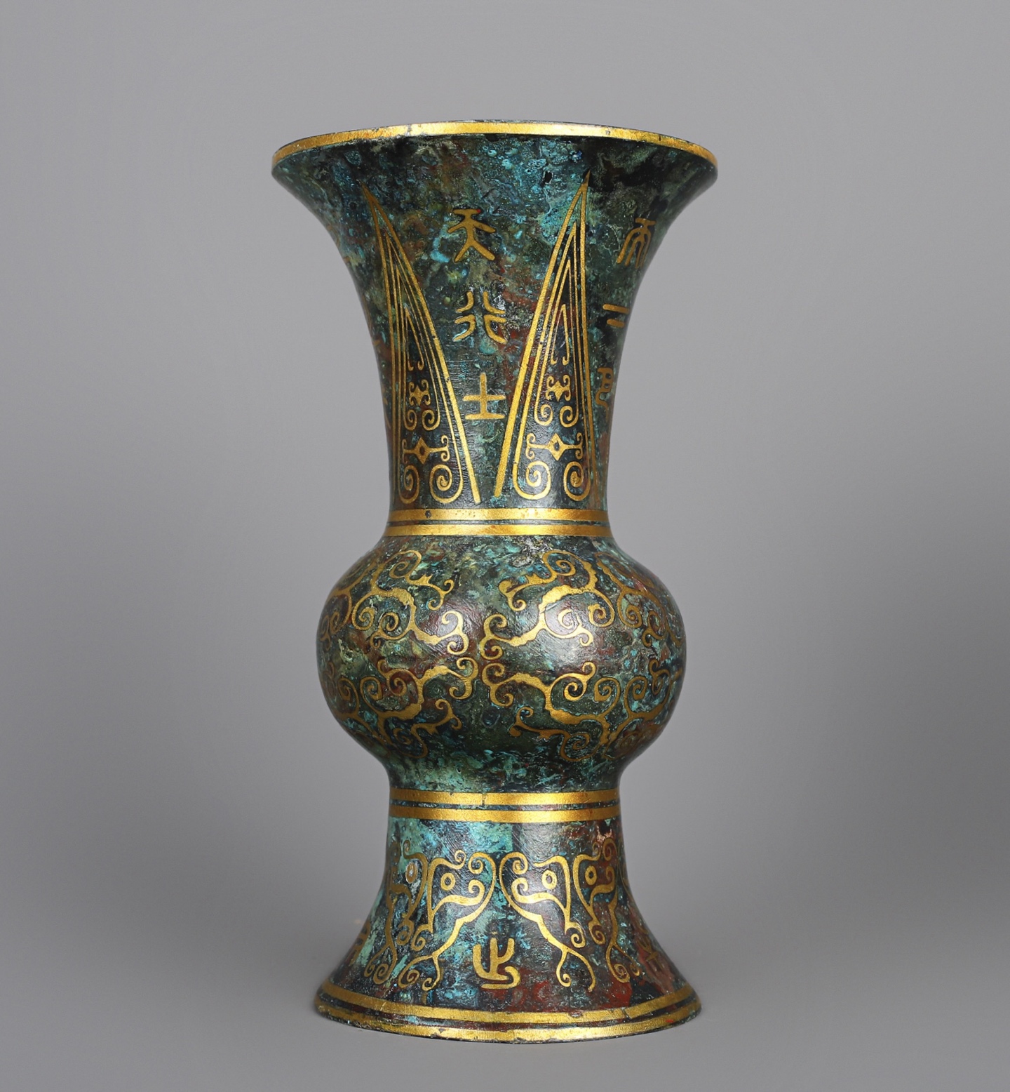 Han Dynasty A pair of bronze and gold round statues